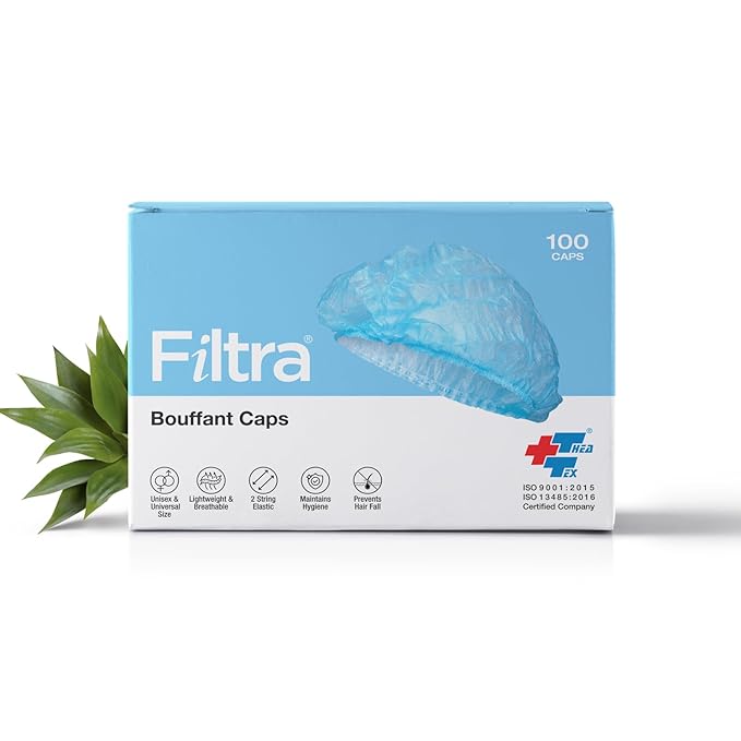 A box of FILTRA Disposable Bouffant Caps, containing 100 blue caps.